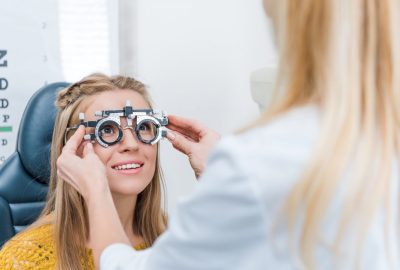 oculist-and-young-patient-with-trial-frame-in-clinic.jpg oculist-and-young-patient-with-trial-frame-in-clinic.jpg